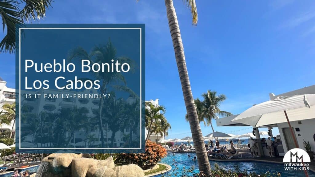A sunny view of the Mediterranean-inspired pool area at Pueblo Bonito Los Cabos, surrounded by lounge chairs, umbrellas, and vibrant tropical landscaping.