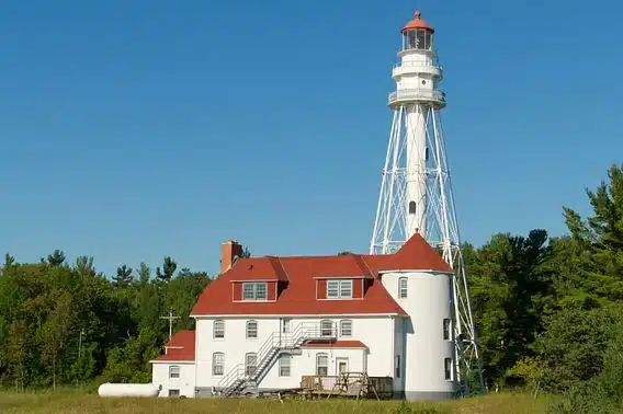 Rawley Point Lighthouse with keeper’s house along Lake Michigan shoreline