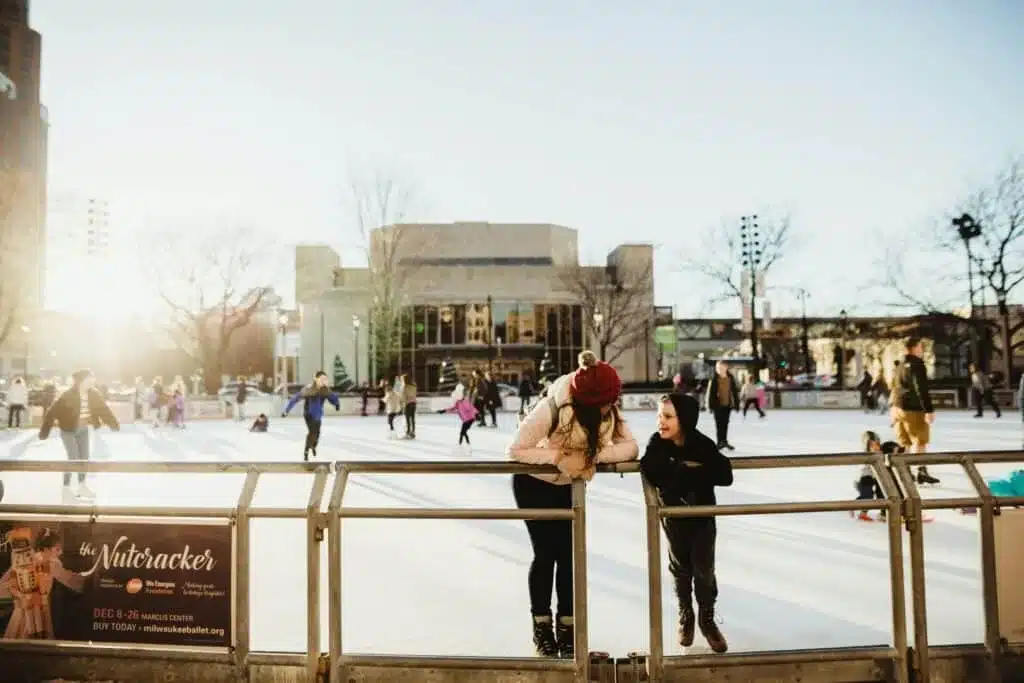 Kids ice skating at Red Arrow Park in downtown Milwaukee