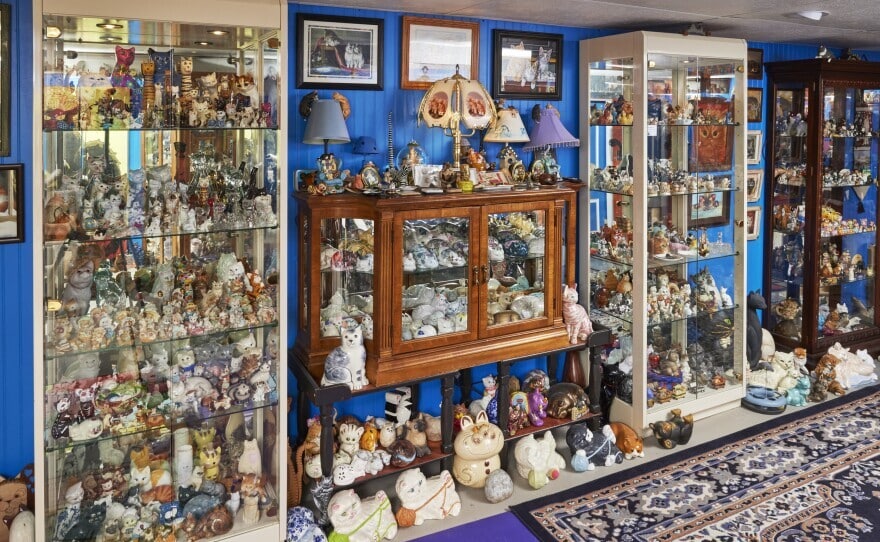 Display cabinets full of cat figurines at Redner's Rescued Cat Figurine Mewseum in Menomonee Falls