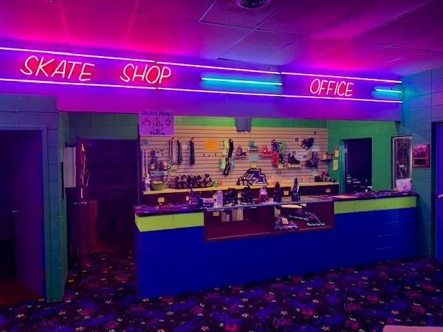 A roller skating rink counter with shoe displayes and neon lights at Milwaukee.