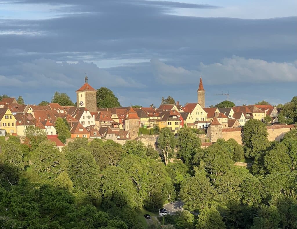 View of the city walls slightly hidden by lush greenery
