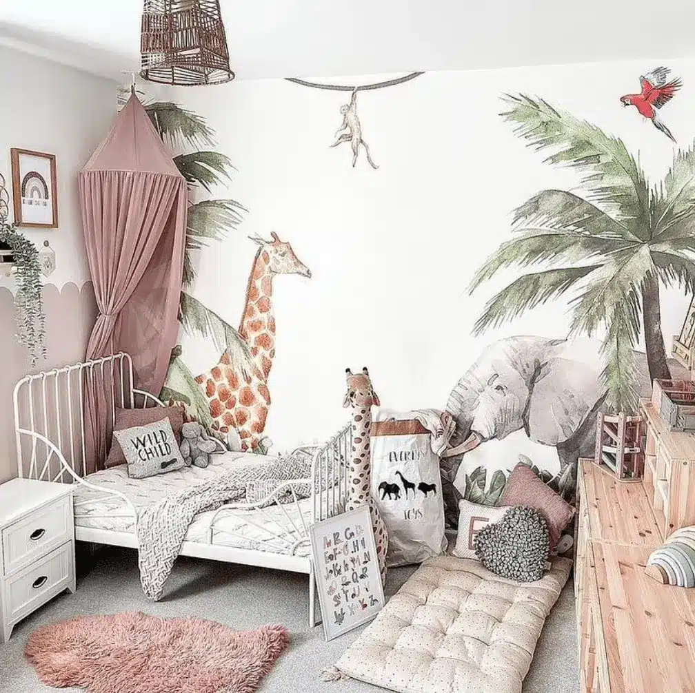 Safari gender-neutral nursery with jungle mural and animal decor