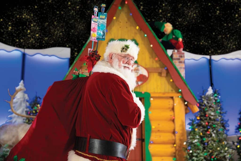 Santa carrying his sack of gifts at Santa's Wonderland at Cabela's event in Richfield