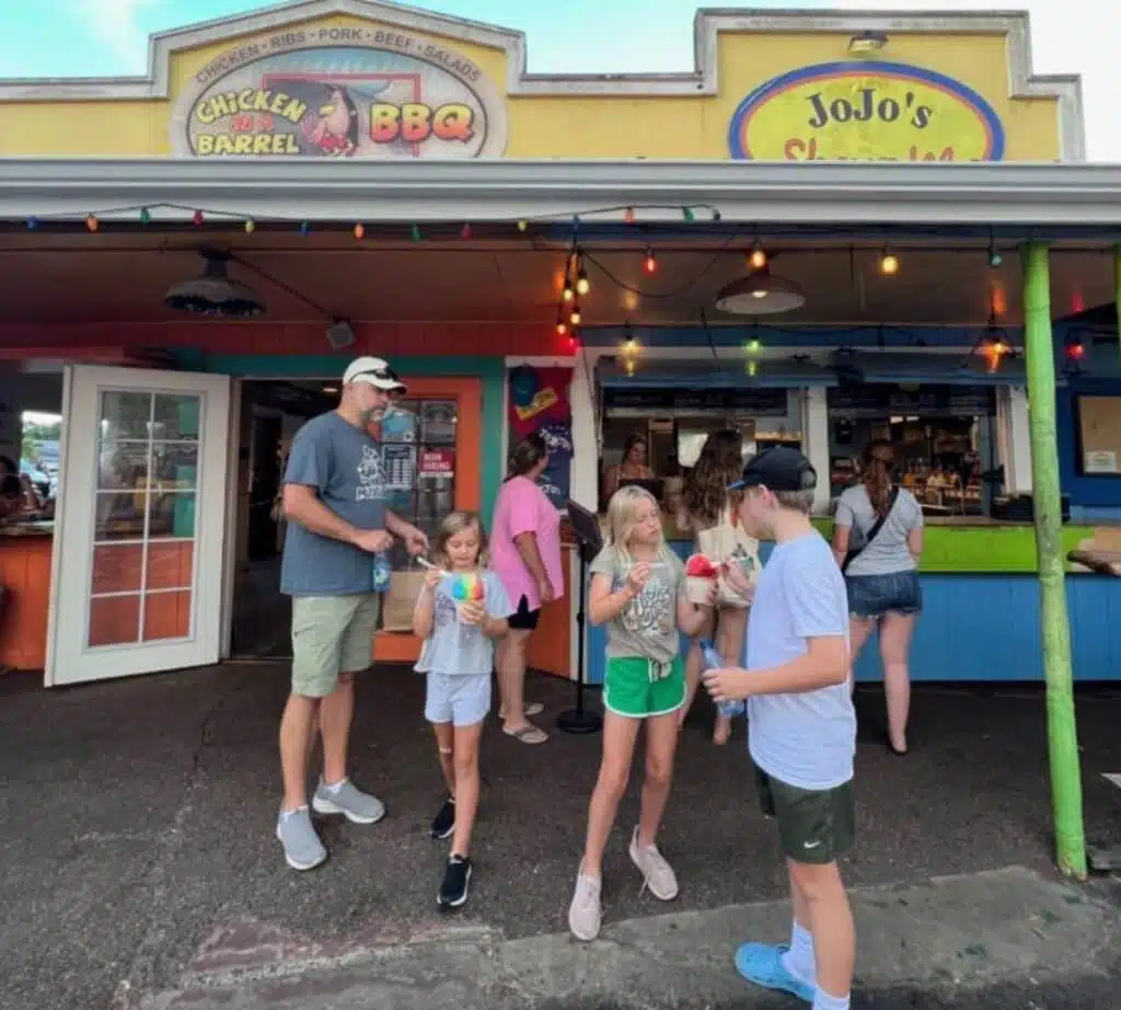 People ordering and trying shave ice at Jojo's in Kauai Hawaii