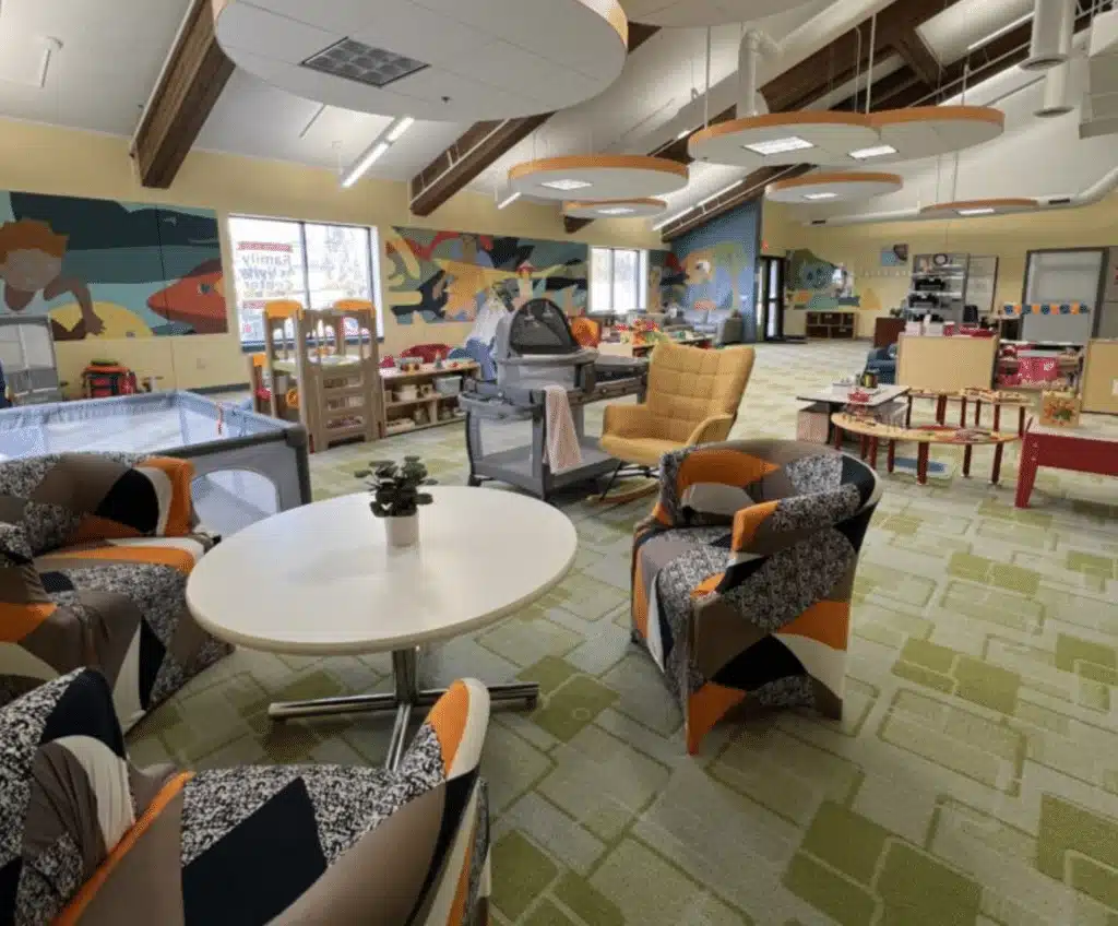 Chairs, tables and cribs on the large play area of St Francis Children's Center