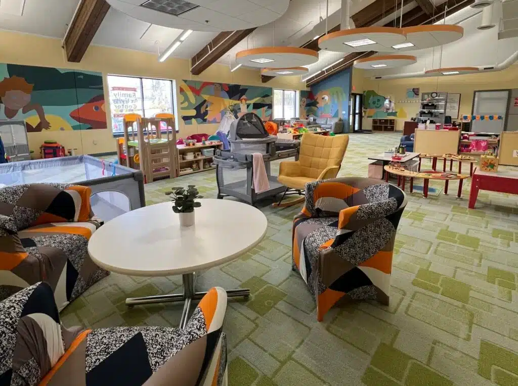 The play area of St. Francis Children's Center in Milwaukee with colorful murals, chairs and flooring