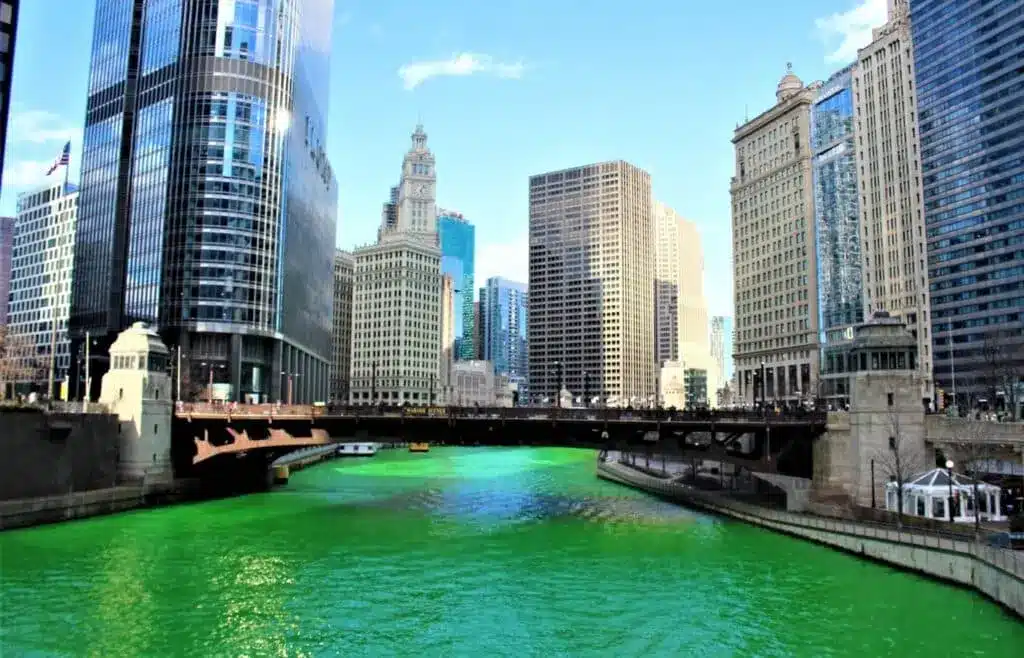 Chicago River turning green on St. Patrick's Day with view of Chicago skyscrapers