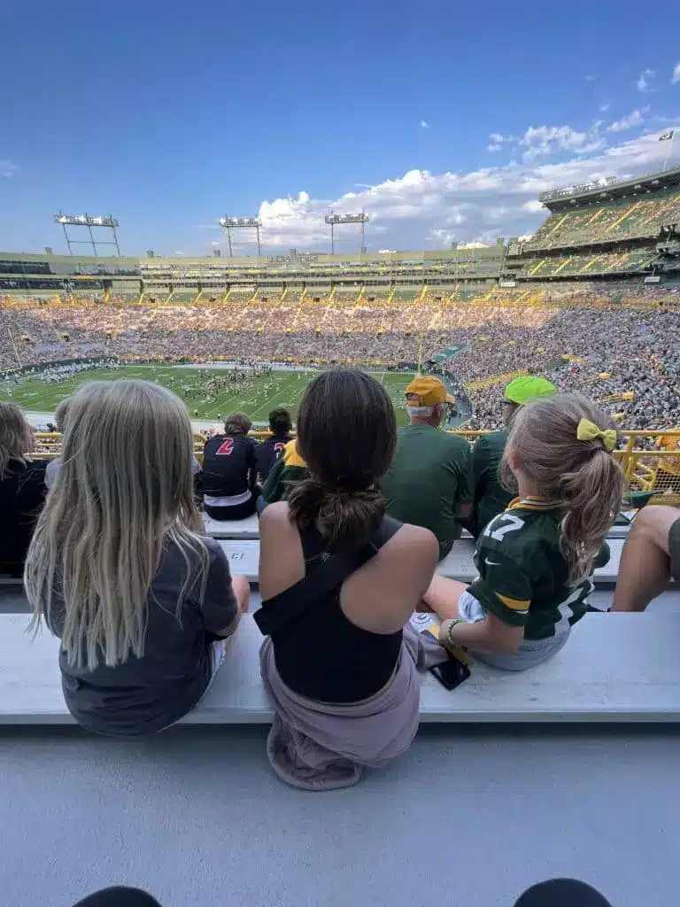 People watching a football tournament in a large stadium