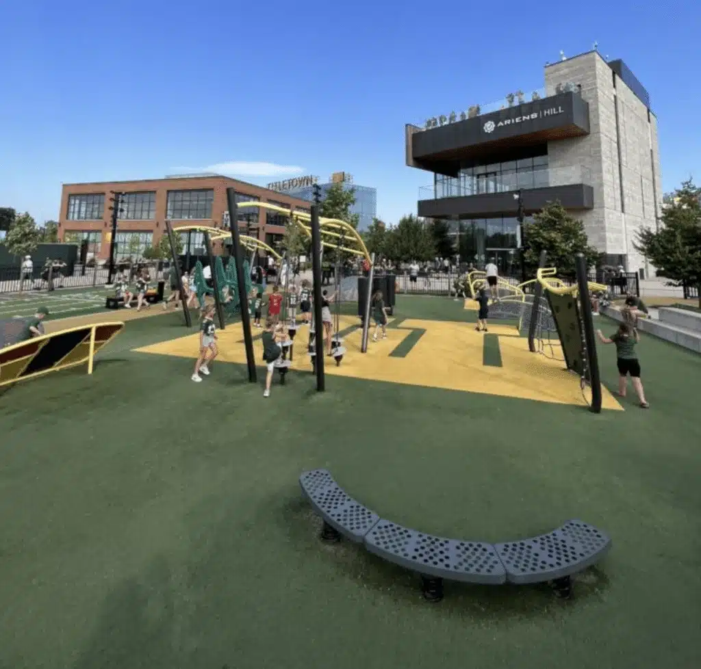 Children playing at the playground in Titletown District in Green Bay