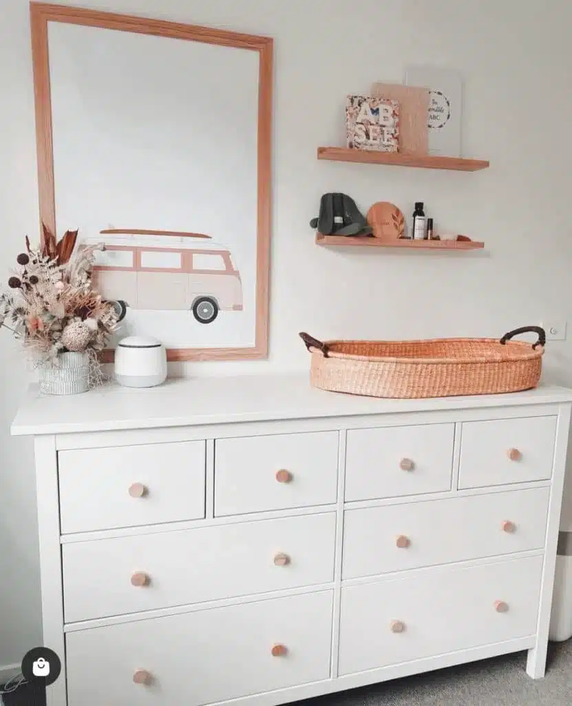 Vintage bus neutral gender-neutral nursery with white dresser and woven changing basket