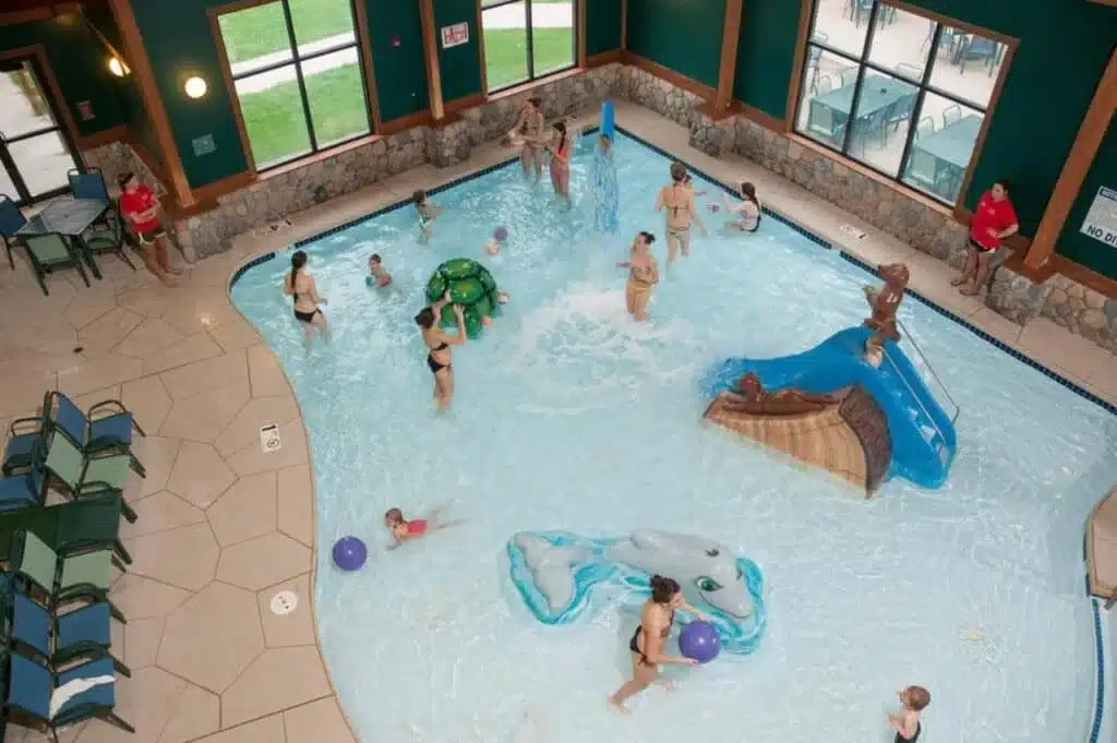 Small indoor hotel water park with slides and shallow pool at The Waters of Minocqua resort