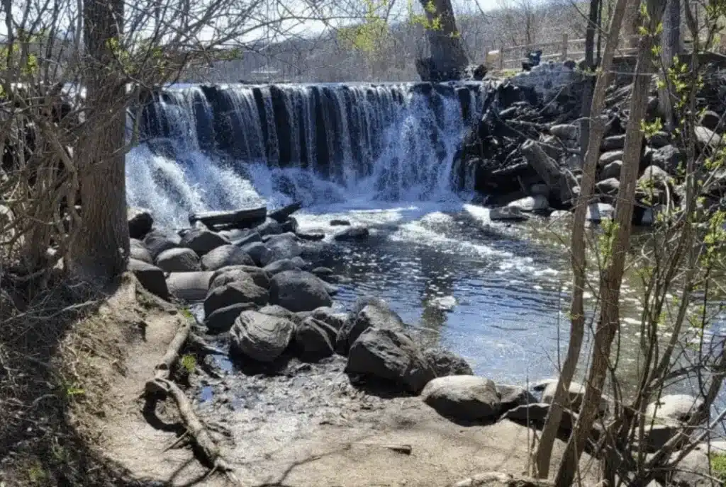 Waterfall flowing over rocks along the Lake Loop Trail at Wehr Nature Center.