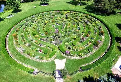 Aerial view of green natural labyrinth spotted with plants in West Bend, Wisconsin.