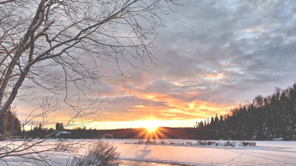 Snowy landscape during sunrise - winter solstice trivia for children