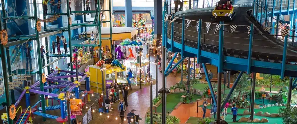 A wide view of Tom Foolerys Adventure Park iin Wisconsin Dells, featuring a ropes course and mini golf.